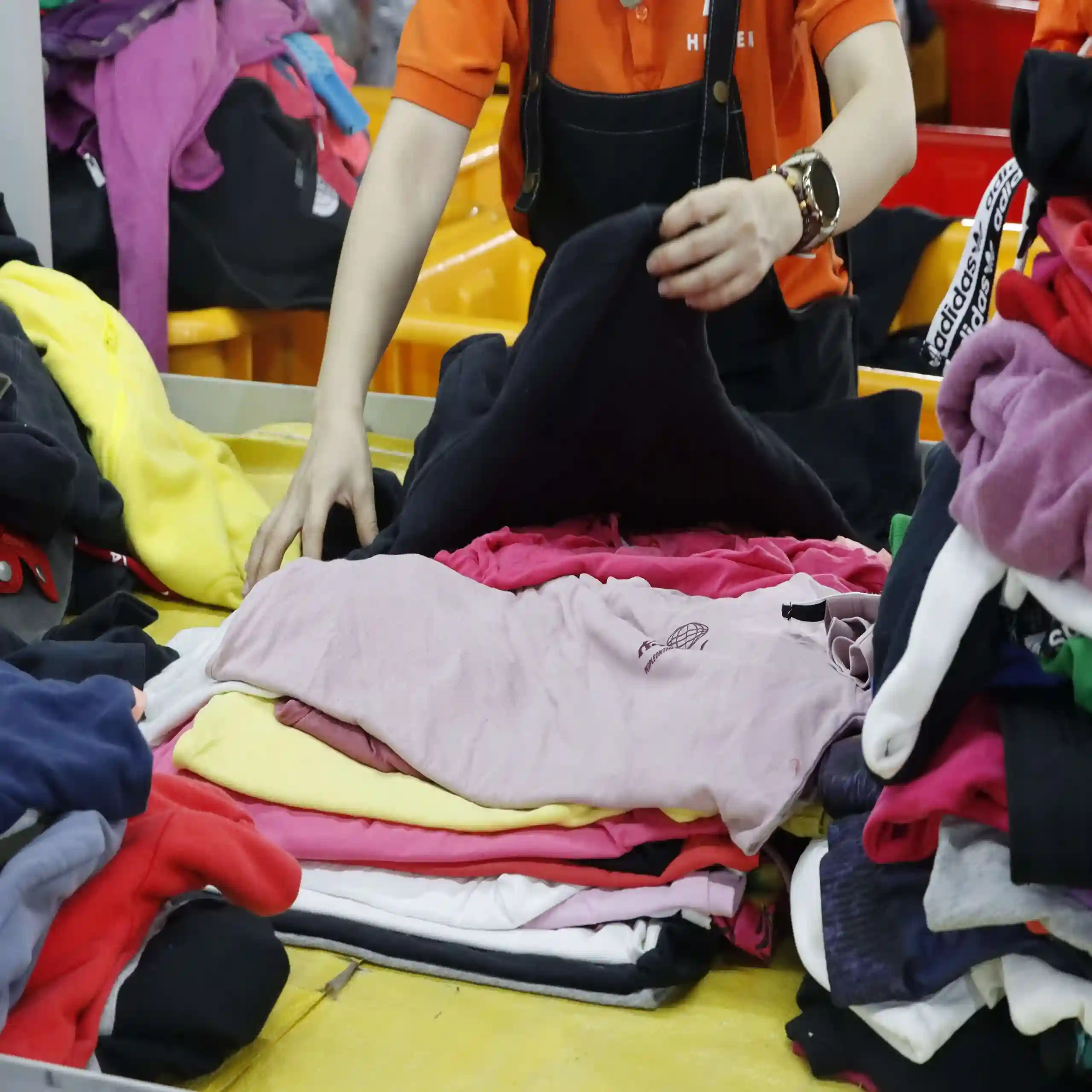 worker is sorting thrift clothes.webp